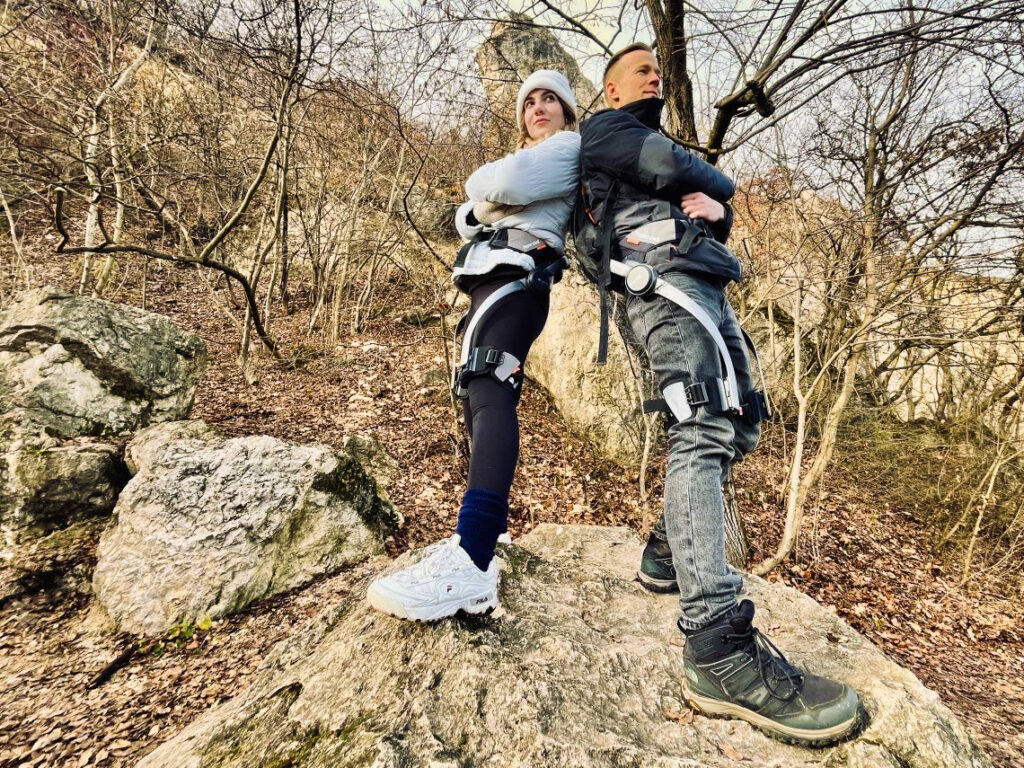 Two people wearing Hypershell exoskeletons during a hike near Budapest, Hungary